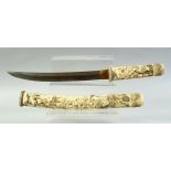 A GOOD QUALITY JAPANESE MEIJI PERIOD SECTIONAL IVORY TANTO, the sheath and handle well carved with