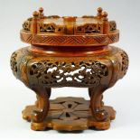 A LARGE CHINESE CARVED HARDWOOD STAND, 25cm high.