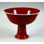 A CHINESE COPPER RED PORCELAIN STEM CUP, the inner foot rim with six character mark, bowl 15.5cm