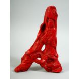 A GOOD 19TH/20TH CENTURY CHINESE PIECE OF CARVED RED CORAL, in the form of Guanyin supported by a