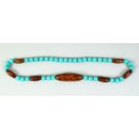 A CHINESE TURQUOISE AND DZI BEADED NECKLACE.