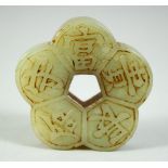 A CHINESE CELADON JADE PENDANT, of lobed pentafoil form, decorated with auspicious characters, 2in