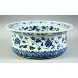 A LARGE CHINESE BLUE AND WHITE PORCELAIN WASH BOWL, decorated with lotus, vine and with treasure