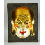 A CHINESE LACQUERED CONCAVE PICTURE OF A FACE, signed to reverse, 31cm x 24cm.
