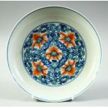 A GOOD CHINESE BLUE, WHITE AND CORAL RED PORCELAIN DISH, decorated with red flower heads and