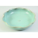 A CHINESE CELADON LILY PAD FORMED DISH, 20cm diameter.