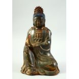 A CHINESE BRONZE BUDDHA, with traces of gilt and red paint, 24cm high.