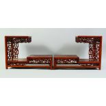 A PAIR OF CHINESE HARDWOOD RECTANULAR THREE TIER STANDS, 34.5cm long, 25cm high.
