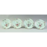 FOUR CHINESE FAMILLE ROSE PORCELAIN DISHES, each painted with flowers, 16.5cm diameter.