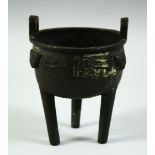 A CHINESE MING STYLE BRONZE TRIPOD CENSER, possibly early, 13cm high.
