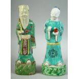 A PAIR OF 18TH CENTURY CHINESE PORCELAIN IMMORTAL FIGURES, 23cm and 22.5cm high.