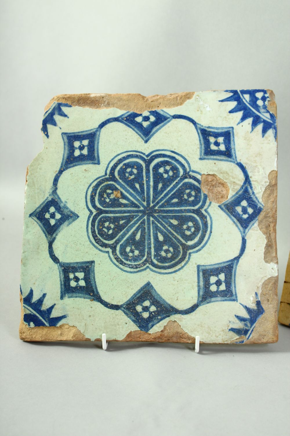 FOUR ISLAMIC GLAZED POTTERY TILES, three with foliate decoration and one with a section of a figure, - Image 2 of 5