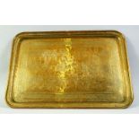A FINE LARGE 19TH CENTURY PERSIAN QAJAR ENGRAVED BRASS TRAY, depicting a battle scene, signed to the