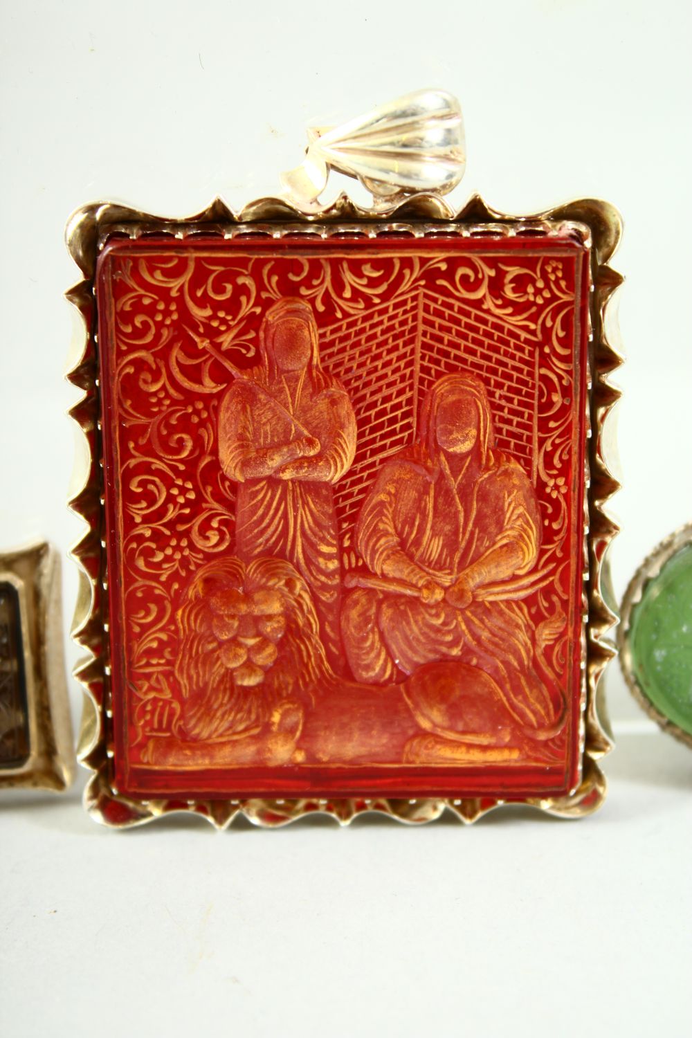 SIX ISLAMIC ENGRAVED WHITE METAL ENCASED SEALS, of various stones, together with a turquoise stone - Image 3 of 8