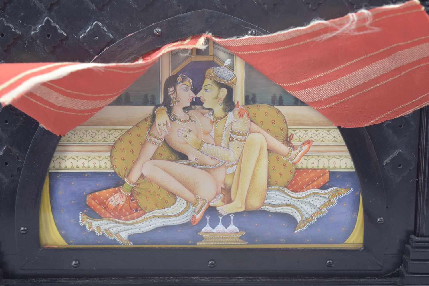 A SMALL INDIAN EBONISED TABLE SCREEN, inset with a painting of an erotic scene with pierced silver - Image 3 of 5