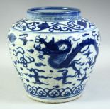 A CHINESE BLUE AND WHITE PORCELAIN JAR, decorated with dragons and the flaming pearl of wisdom, 21cm