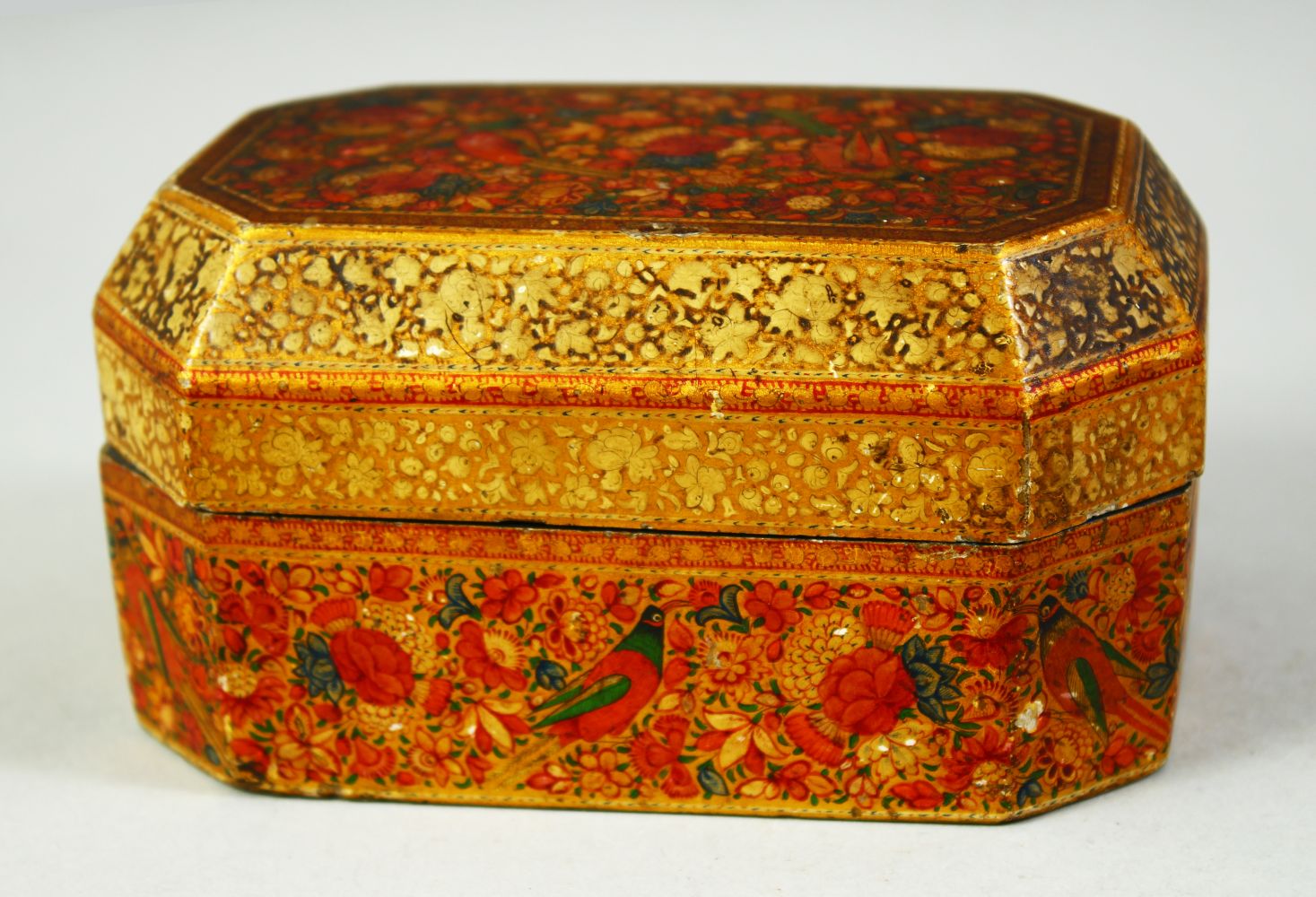 A FINE 19TH CENTURY KASHMIRI LACQUERED PAPIER MACHE LIDDED BOX, decorated with birds and flora, 13.