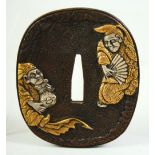 A JAPANESE BRONZE SHAKUDO TSUBA, depicting two amusing figures, the reverse with a gourd shape flask