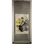 A 20TH CENTURY CHINESE HANGING SCROLL PAINTING ON PAPER, depicting yellow flowers, leafage and