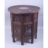 A GOOD MOORISH BONE INLAID CIRCULAR TABLE, carved with two bands of grape and vine and ornate