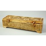 A FINE AND RARE 17TH/18TH CENTURY SOUTH INDIAN CARVED IVORY PEN BOX, the hinged lid carved with