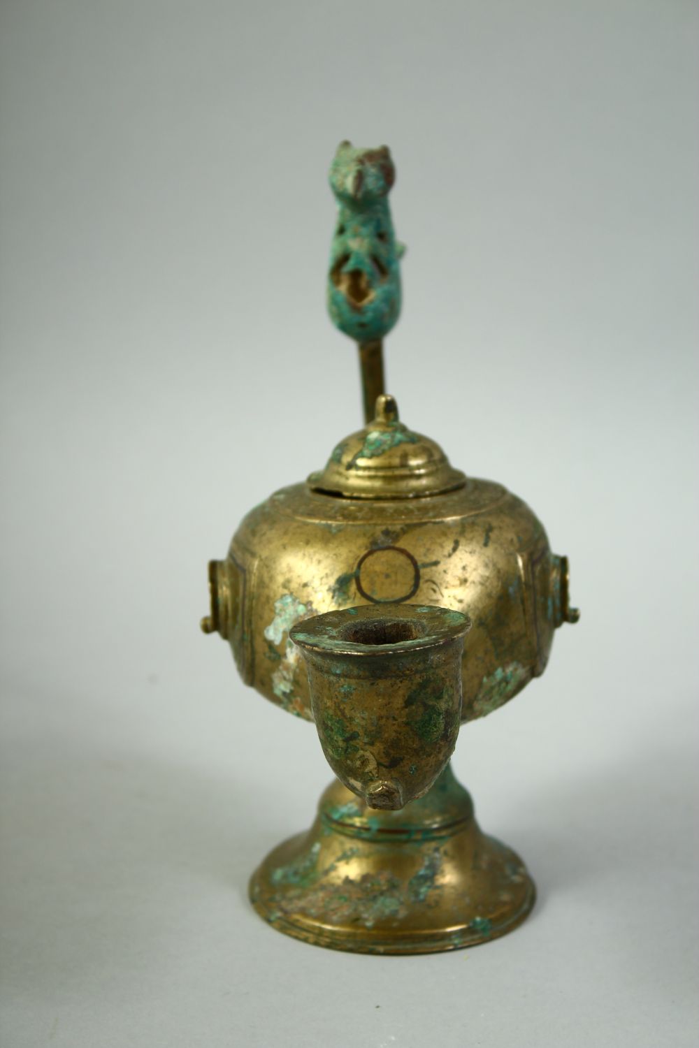 AN ISLAMIC GILT BRONZE OIL LAMP, with lid and zoomorphic finial, 20cm long. - Image 2 of 5