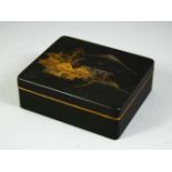 A JAPANESE KOMAI CIGARETTE BOX, the lid illustrated with a village scene and mount fuji beyond,