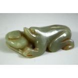 A CHINESE JADE CARVING OF A FROG, 8.5cm long.