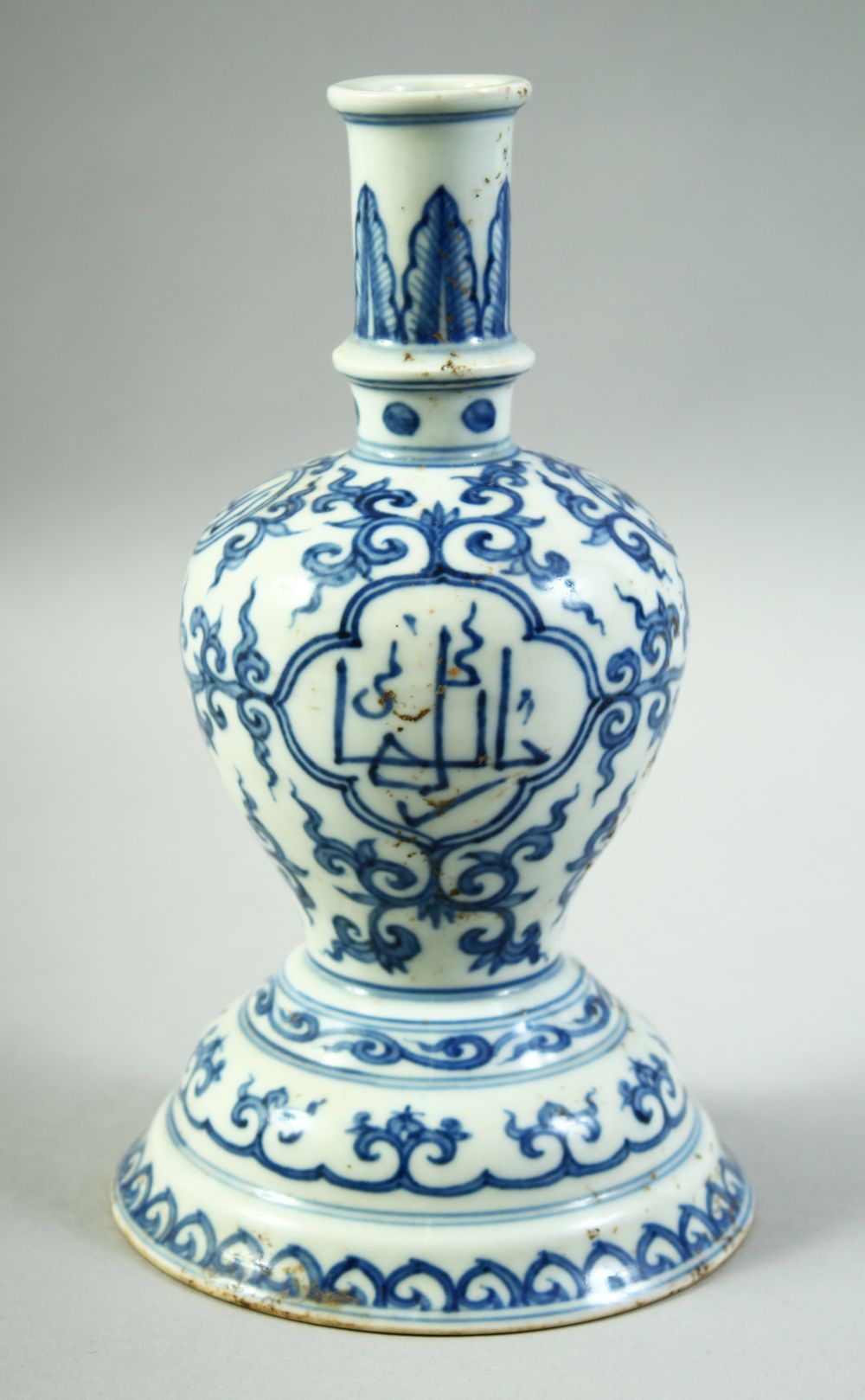 A CHINESE BLUE AND WHITE PORCELAIN CANDLE STAND, for the Islamic market, with calligraphic