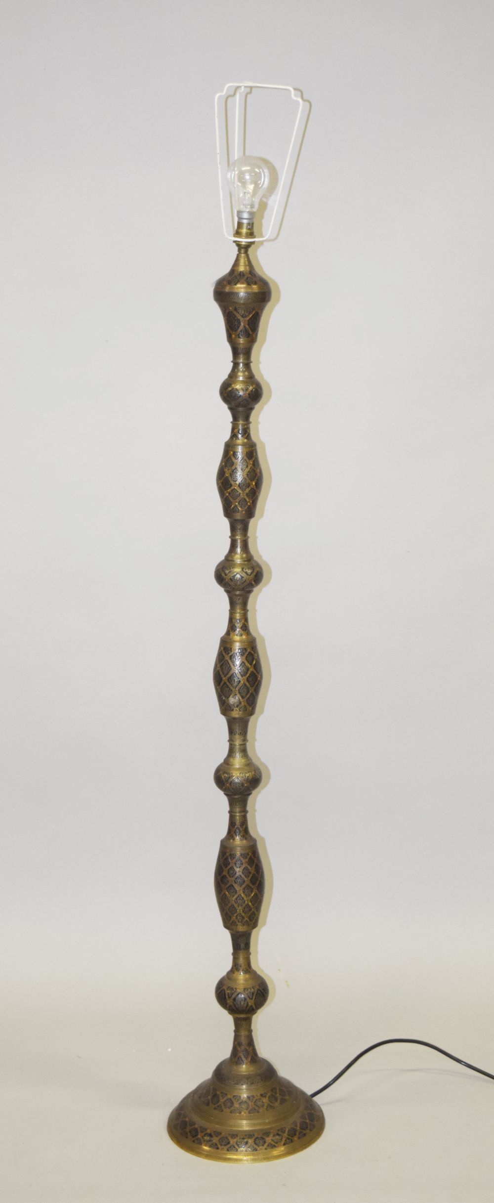 AN ISLAMIC METAL FLOOR STANDING LAMP, 156cm high.