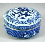 A CHINESE BLUE AND WHITE PORCELAIN CIRCULAR BOX AND COVER, the cover with a central dragon, the