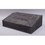 A LARGE INDIAN STAGHORN VENEERED WRITING SLOPE, the interior with sandalwood compartments and ivory,