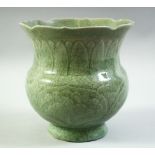 A CHINESE CELADON GLAZE PORCELAIN VASE, with incised decoration under glaze, (af), 18cm high.