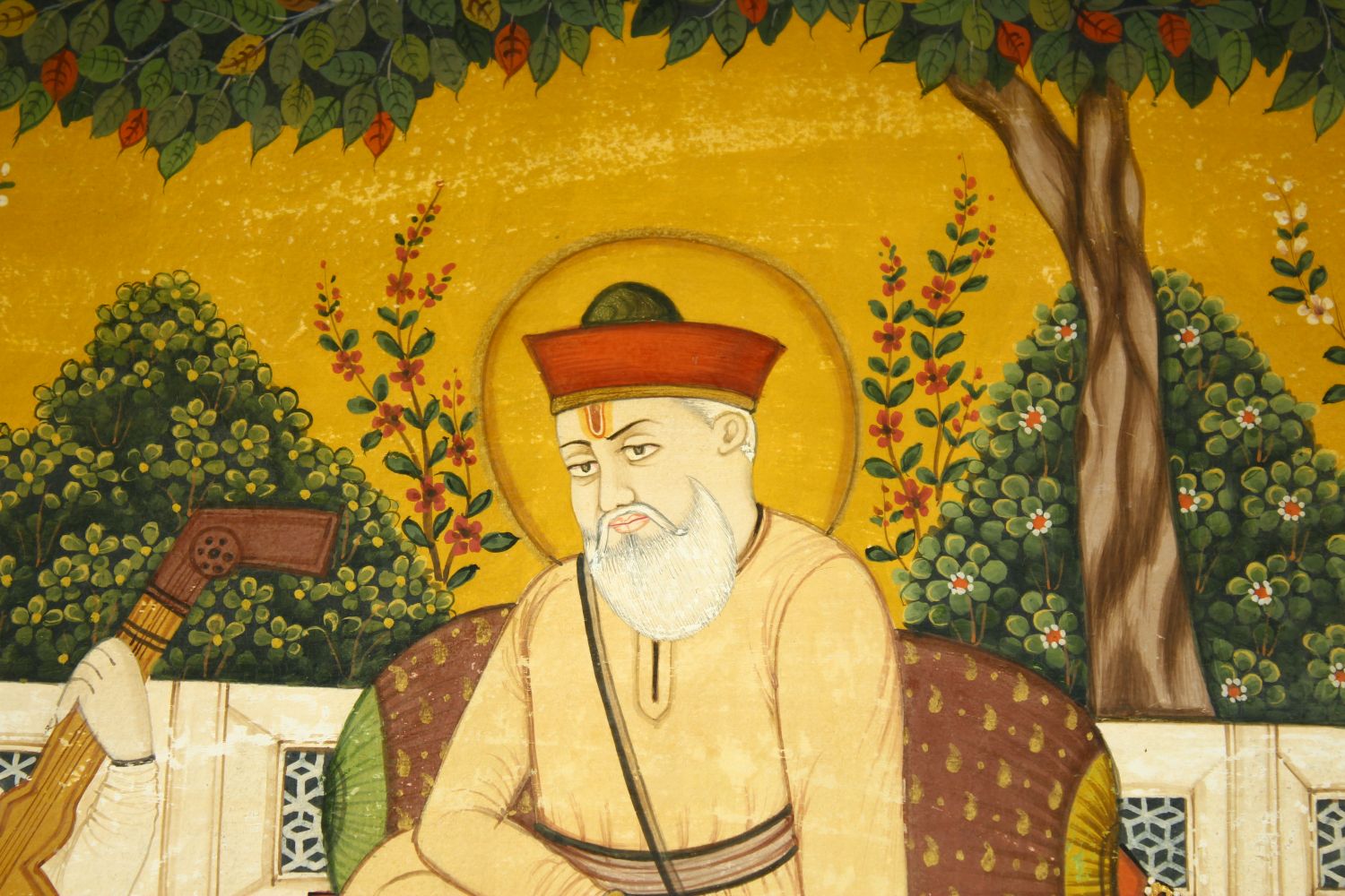 A LARGE INDIAN MINIATURE PAINTING ON PAPER, depicting a seated holy man with a musician and - Image 3 of 6