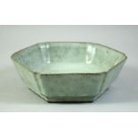 A CHINESE CELADON HEXAGONAL BOWL, 17cm diameter.