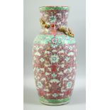 A LARGE CHINESE PINK GROUND FAMILLE ROSE PORCELAIN VASE, decorated with flower and bat motifs and