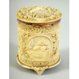 A FINE RARE 18TH CENTURY SRI LANKAN CARVED IVORY CYLINDRICAL BOX, with hinged cover depicting a