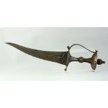 A FINE EARLY LARGE SOUTH INDIAN ALL STEEL DAGGER, with multifullered curving blade, pierced oval