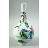 A SMALL CHINESE FAMILLE VERTE PORCELAIN BOTTLE VASE, decorated with various figures in an outdoor
