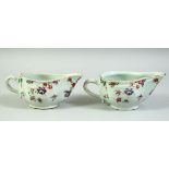 A PAIR OF 18TH CENTURY CHINESE FAMILLE ROSE PORCELAIN SAUCE BOATS, 16.5cm long.