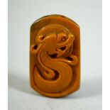 A CHINESE CARVED CORNELIAN PENDANT, 4cm.