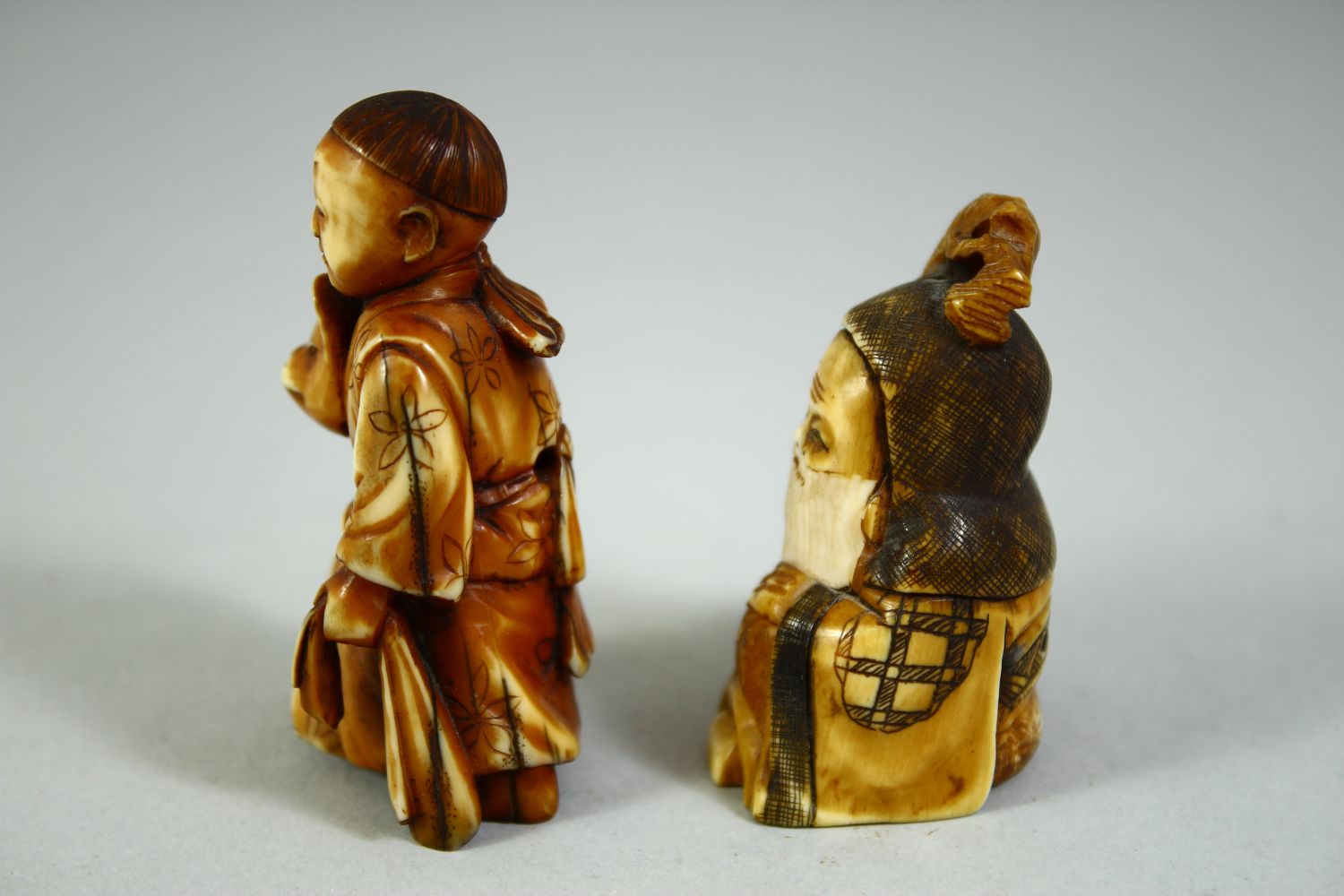 TWO CARVED NETSUKES, one of a boy holding a noh mask, the other of a sage, (2). - Image 4 of 7