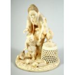 A FINE JAPANESE MEIJI PERIOD CARVED IVORY OKIMONO of an elderly lady with a child and chickens,