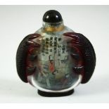 AN EARLY 20TH CENTURY CHINESE INTERIOR PAINTED SNUFF BOTTLE, the side / handles carved as carp, note