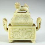 A CHINESE CARVED GREEN HARDSTONE TWIN HANDLE KORO AND COVER, the cover carved with foo dog, with