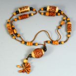 A RARE 18TH CENTURY OR EARLIER OTTOMAN IVORY, WALRUS AND BLACK CORAL BEADED NECKLACE.
