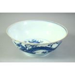 A GOOD CHINESE BLUE AND WHITE PORCELAIN BOWL, painted with dragons, the base with six character