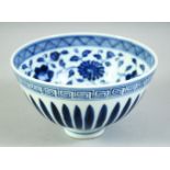 A CHINESE BLUE AND WHITE PORCELAIN BOWL, the interior decorated with large flower heads and