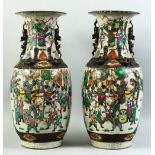 A LARGE PAIR OF CHINESE CRACKLE WARE PORCELAIN VASES, painted with scenes of warriors, with