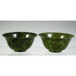 TWO CHINESE SPINACH GREEN JADE BOWLS, 10cm diameter.